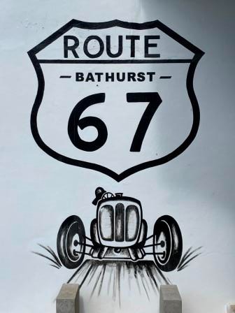 a street sign with a drawing of a car on Route 67, Bathurst, Eastern Cape