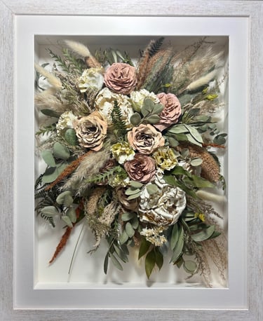a trailing preserved wedding bouquet in a frame