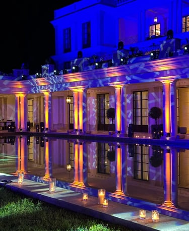 Poolside gala event with blue evening lighting