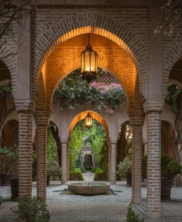 Lantern-lit Moorish colonnade with tiled floor and inner fountain