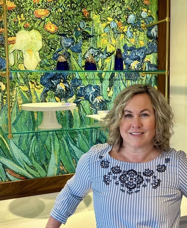 Woman posing in front of stained glass.