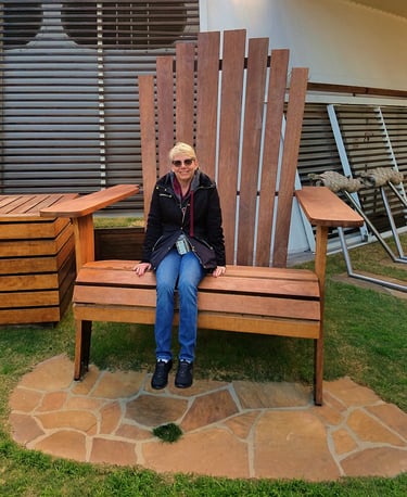 Lady Michelle rests on a rather large lawn chair on the ship