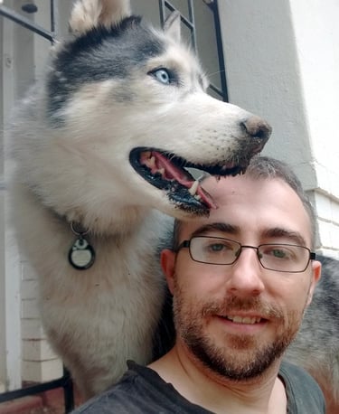 the artist, Will, and his husky dog, Grail, pose for a selfie
