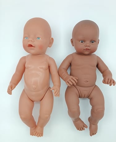 Baby Born doll compared to Minikane Les Bambinis doll