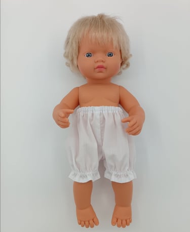 Miniland doll wearing white bloomers