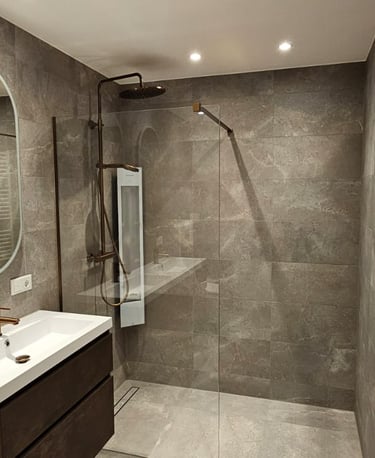 a bathroom with a shower and a large mirror