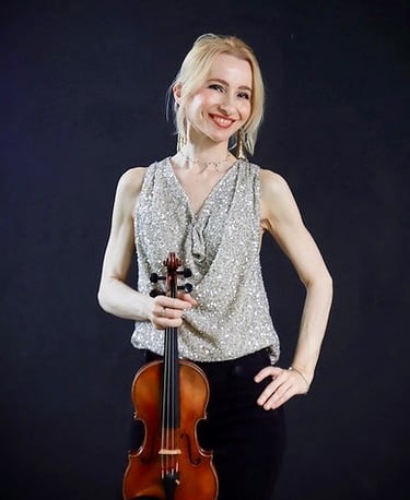Houston violin teacher and performing violinist with her violin