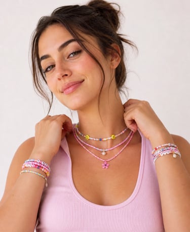 A young woman wearing colorful beaded jewelry, including layered necklaces and stacks of friendship bracelets.