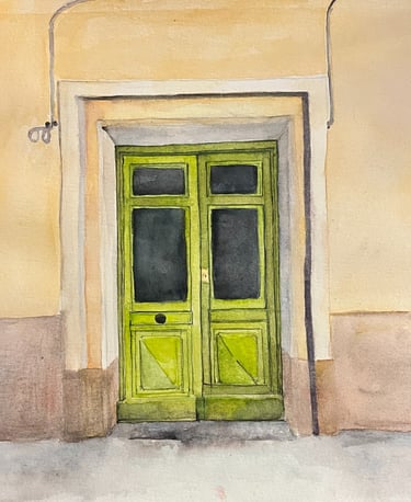 Pistachio green double wooden door set within ochre mineral façade