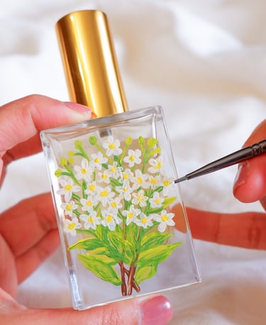Perfume bottle painted with jasmine flowers for an NYC perfume brand by Handwritten by Belle.