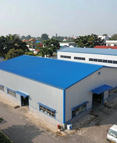 A sleek, modern office building exterior with the FV Roofing logo prominently displayed against a clear blue sky.
