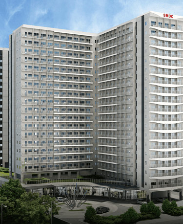 a large building with a tall building in the background