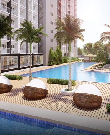 a pool with lounge chairs and a swimming pool