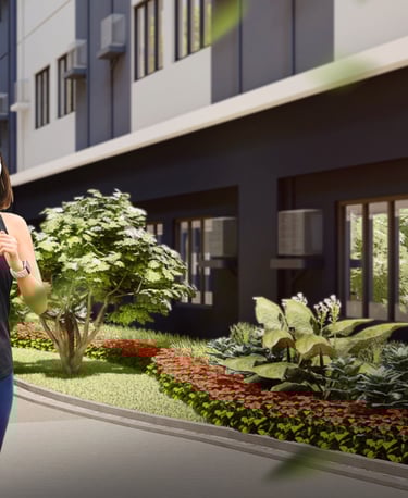 a woman in a black tank top and jeans walking down a sidewalk