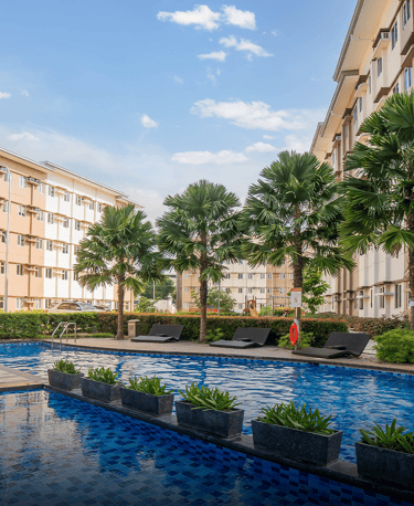 a pool with a lounge chair and a table