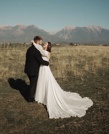bride and groom portrait in a field, Montana mountains