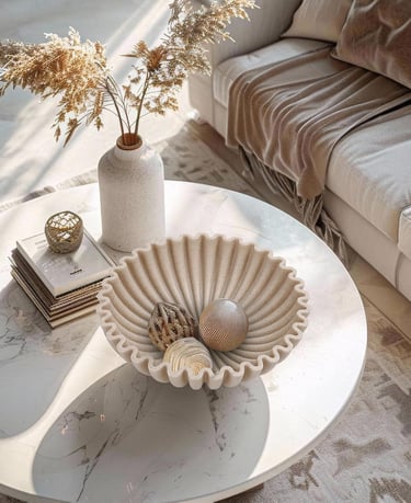 Scalloped decorative bowl styled on a modern coffee table in a cozy neutral living room