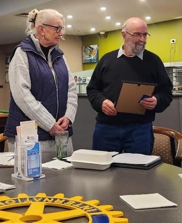 Rebecca Williams awaits receipt of her New Member Pack from President Doug Mitchell