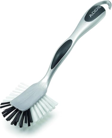 Addis metallic silver dish brush with scraper head and ergonomic non-slip handle.