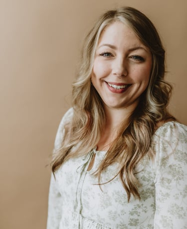 a woman with blonde hair and a white shirt