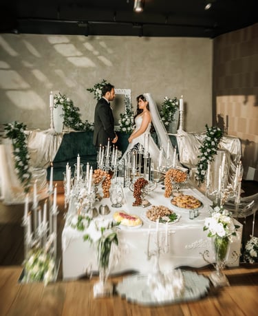 Bride and groom facing each other at Sofreh Aghd setup, captured by Fred Art Studio