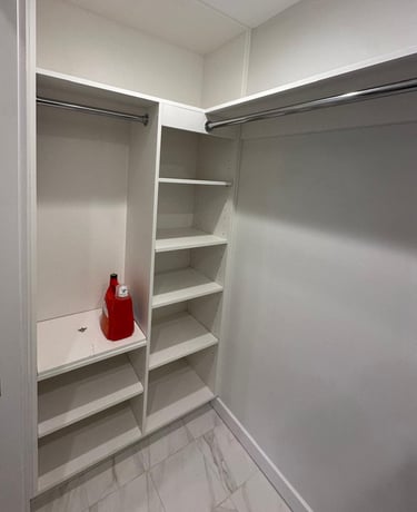 a white closet with shelves and shelves with a red fire hydrant