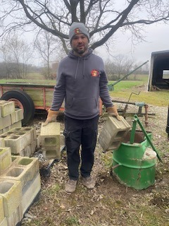 WEARING SAFTEY GLOVES WHILE LOADING CONSTRUCTION DEBRIS