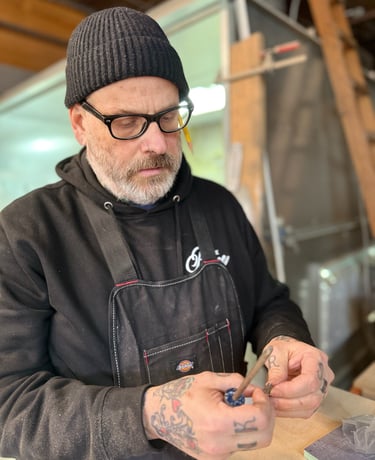 Craftsman custom building woodworking project in woodshop.