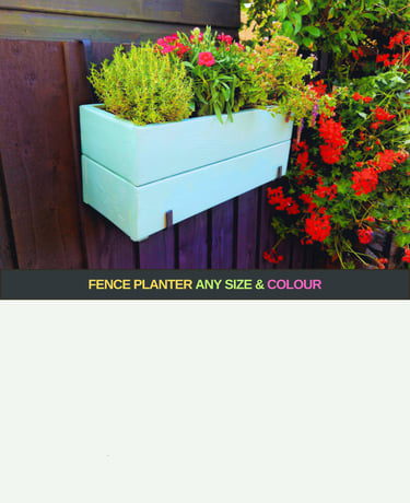 handmade planter box painted in blue with flowers and herbs 