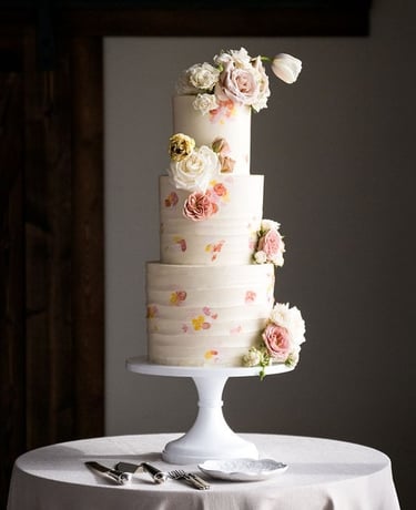 Hand-painted pastel wedding cake made for a destination wedding in Bozeman Montana