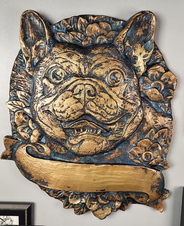 Custom bronze plaque of a French Bullldog with a banner and flowers