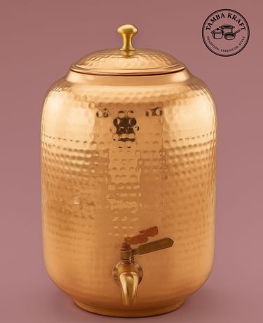 a golden metal beverage dispenser with a faucet