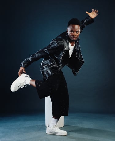 Amapiano teacher Henry of TheOne Studios in Nairobi, wearing black bomber jacket