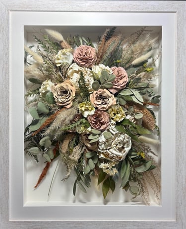 trailing view preserved wedding bouquet with lots of dried stems in a frame