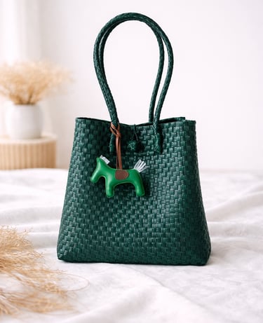 Handwoven bottle green plastic tote bag handmade from recycled materials by Indonesian artisans