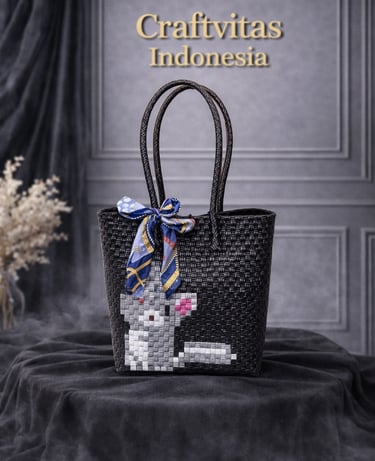 Black and white handmade plastic woven tote bag with cat character design