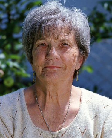 a woman in a white sweater and a necklace with a necklace