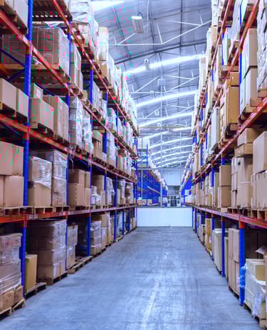 Narrow Aisle Pallet racking in warehouse storing boxes of goods