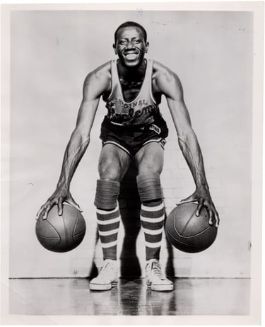 April 18th, 1956 Goose Tatum Team Issue Type 1 photograph holding a basketball in each hand