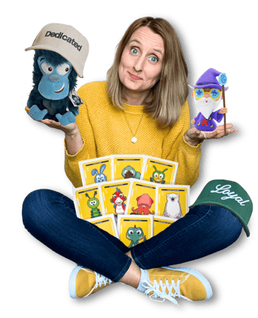 Anne Bagg holding physical Veefriends collectibles like friendscaps, plushies, trading cards, figure
