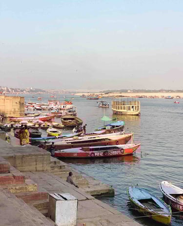Photo of numerous colorful boats on the Ganges River in Varanasi, India.