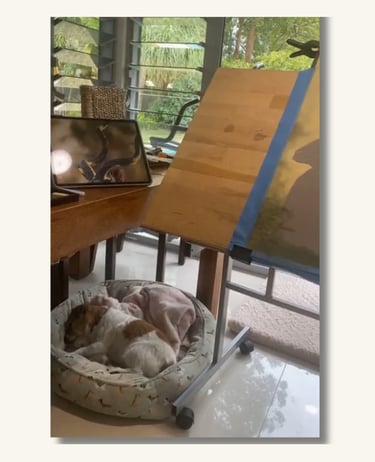 Artist easel and workspace where custom pet portraits are created by hand.
