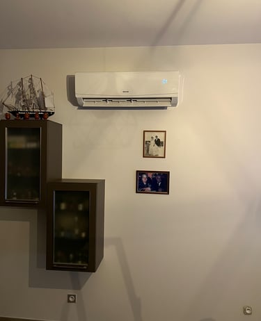 a wall mounted air conditioner with a tv and a television