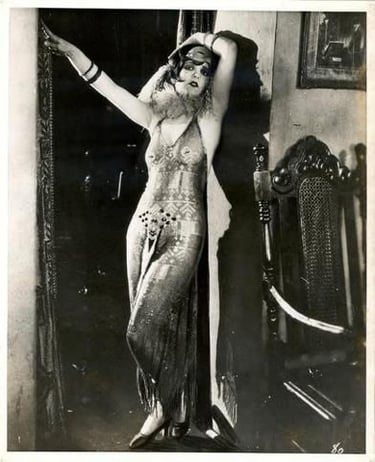 Clara bow movie photo wearing sultry Egyptian gown made of Assuit fabric, from the movie It 1927