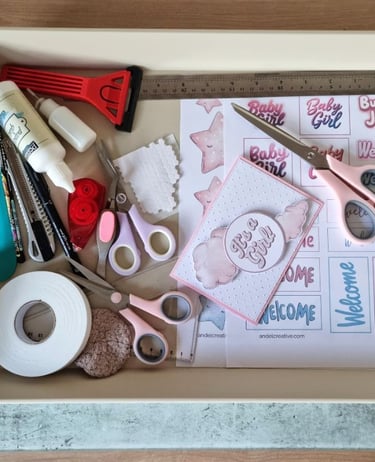 A tray with basic card making tools and printables for handmade greeting cards