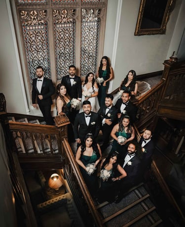 Wedding party on grand staircase, shot by Fred Art Studio
