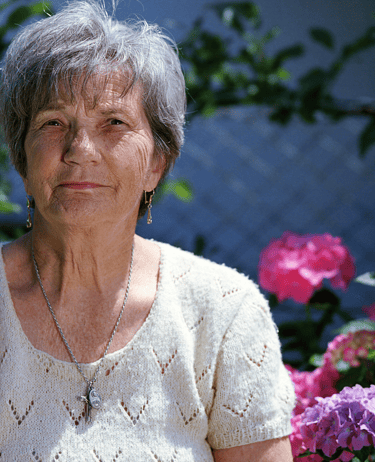a woman in a white sweater and a necklace with a necklace