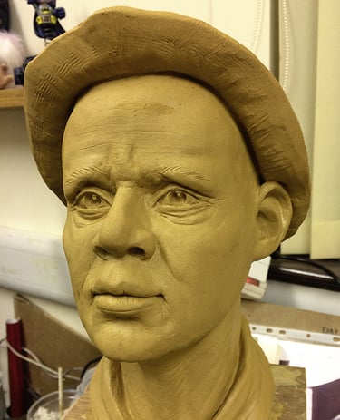 Realistic male portrait bust sculpted in clay for bespoke 3D sculptural services