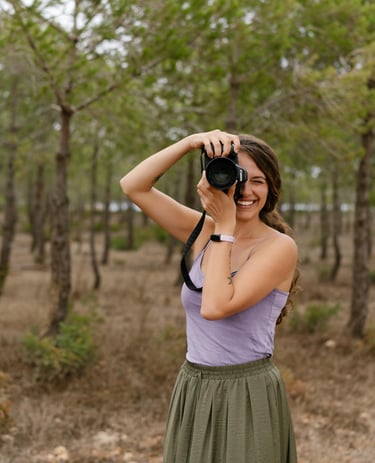 a woman taking a picture of herself taking a picture of herself