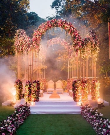 a wedding ceremony with a floral arch